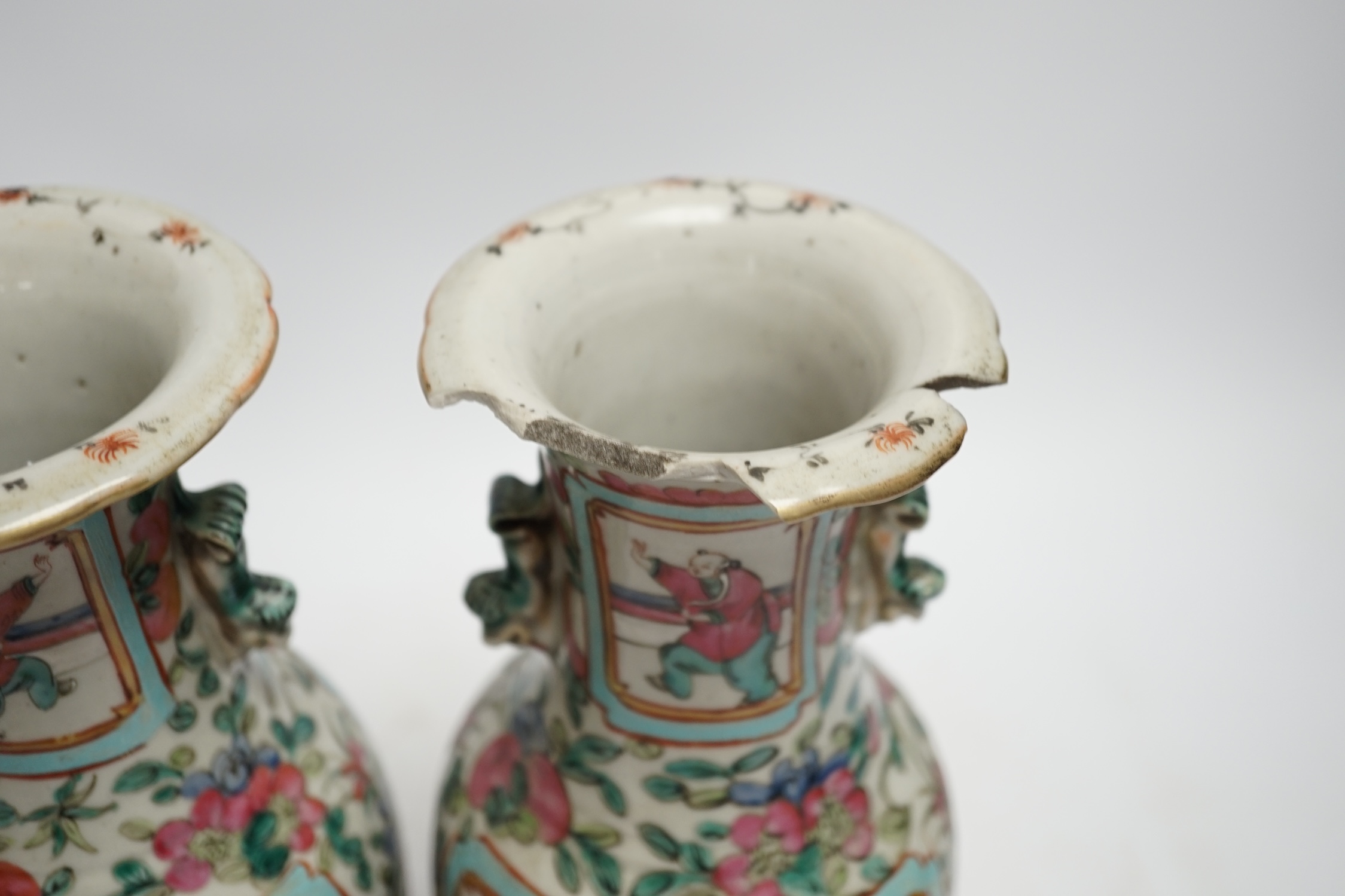 A pair of 19th century Chinese famille rose vases, 25cm high